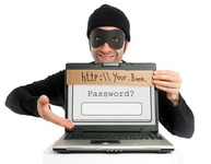 Dieb mit Maske hinter Laptop bittet um Passworteingabe (Bild: carlos_bcn / fotolia.com)